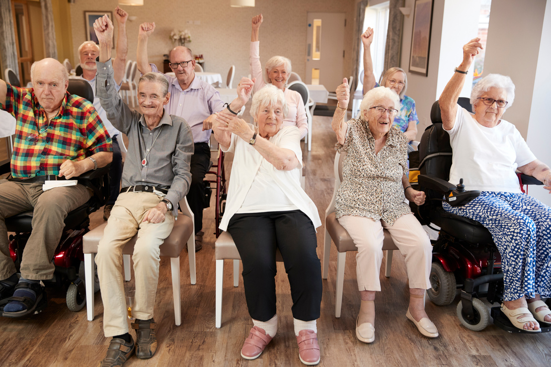 Group of Seniors Enjoying Fitness Class in Retirement Home